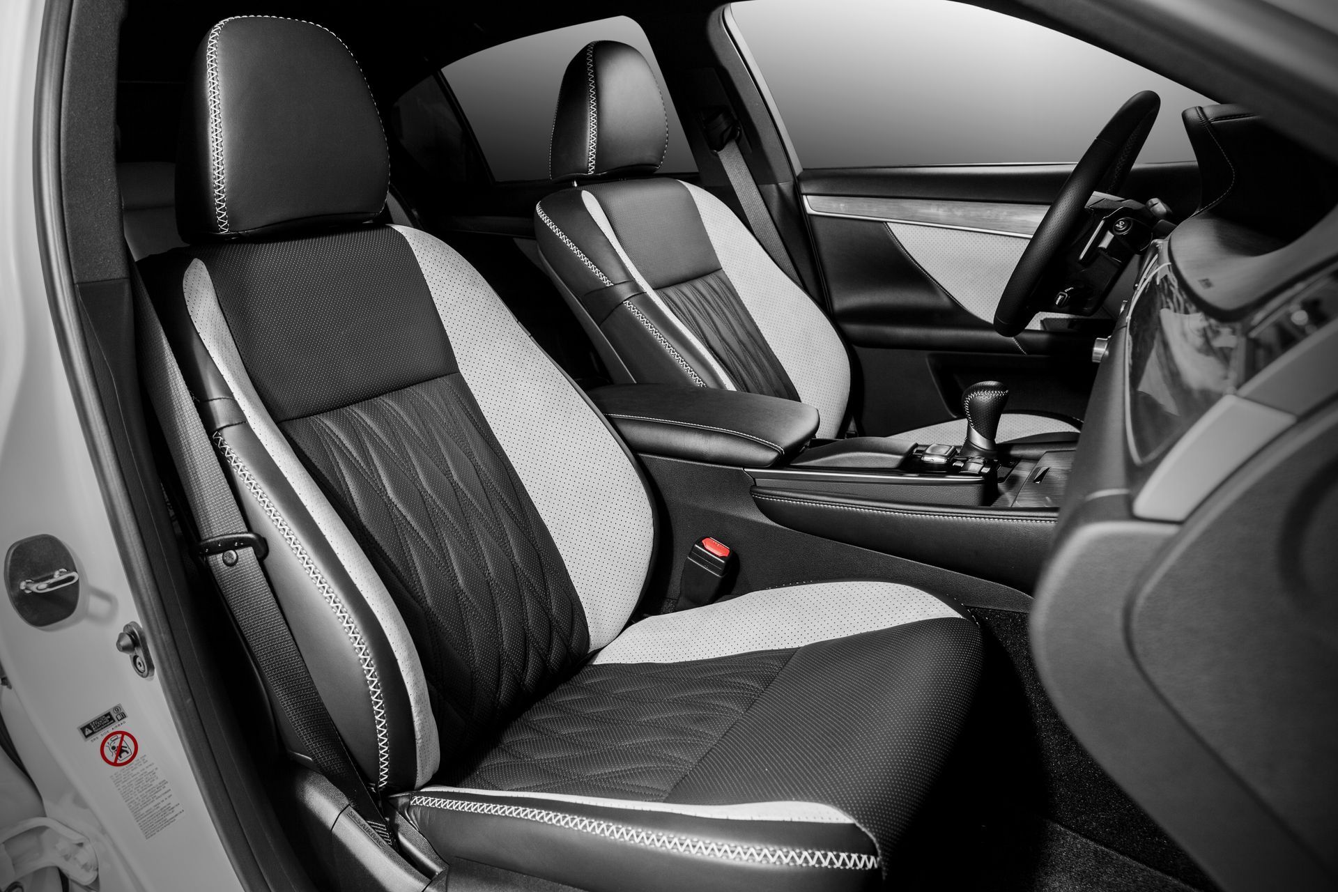 The interior of a car with black and white seats
