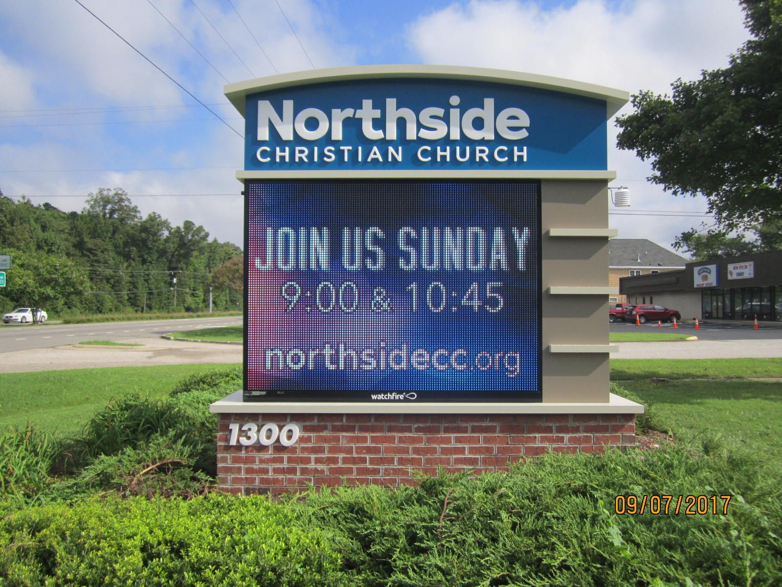 A sign for northside christian church says join us sunday