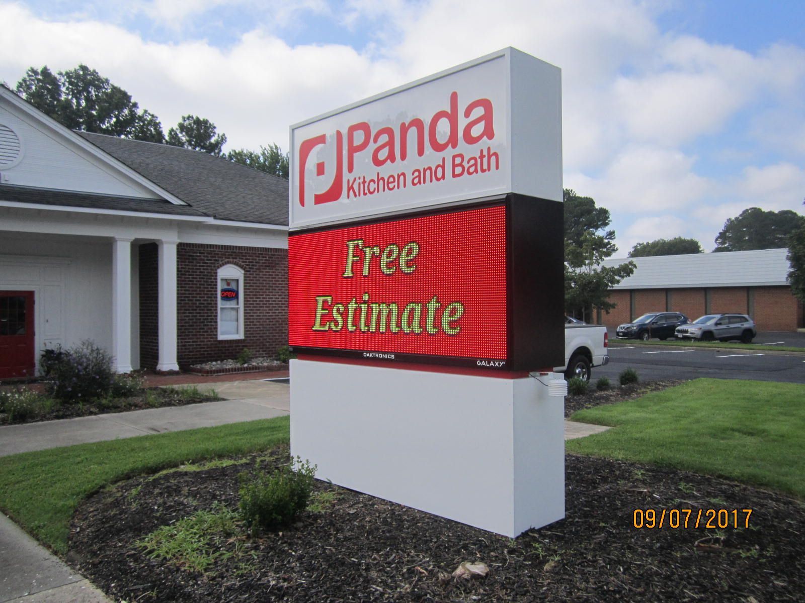 A panda kitchen and bath sign that says free estimate