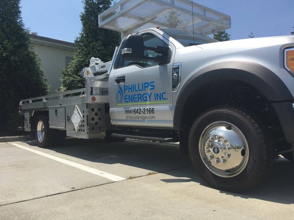 A phillips energy truck is parked in a parking lot.