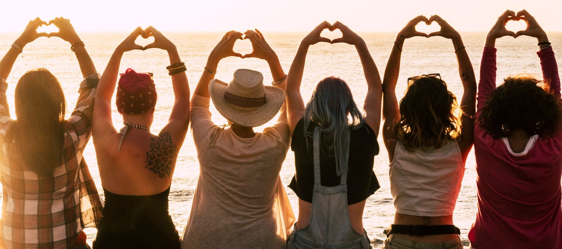 A woman is eating a salad with a fork from a bowl.