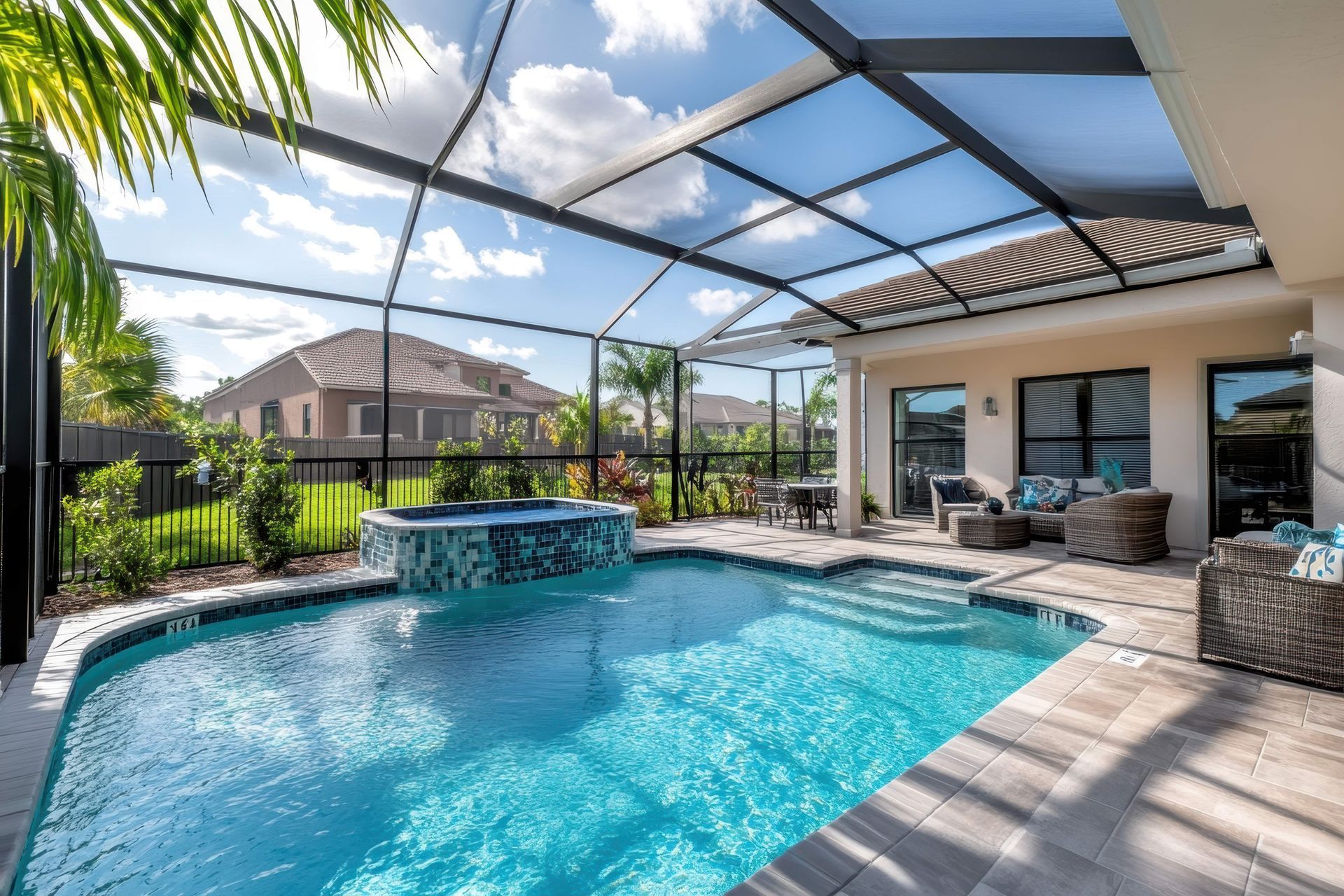 Elegant poolside retreat with screened enclosure and sunny patio.