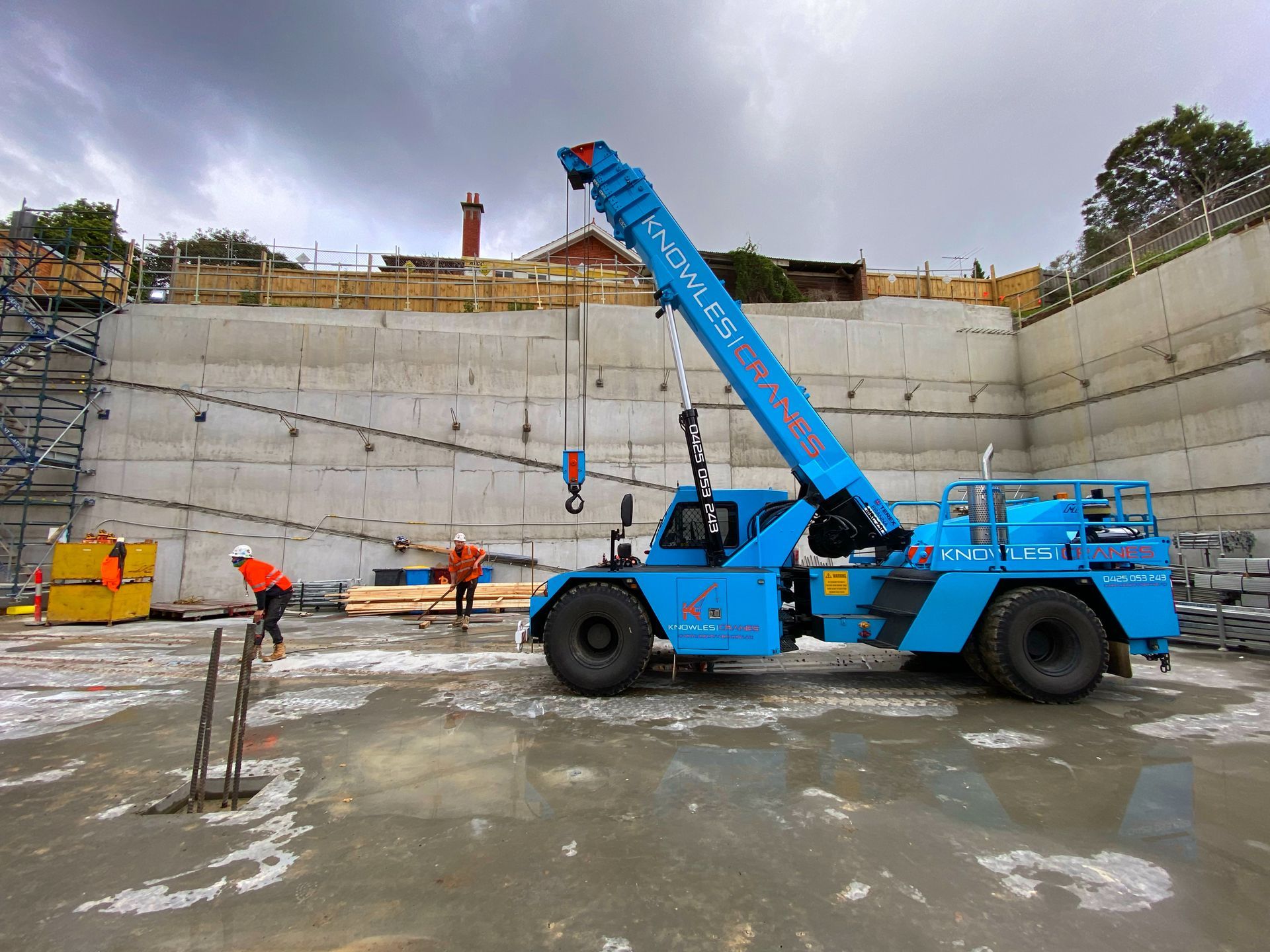Crane lifting steel beams