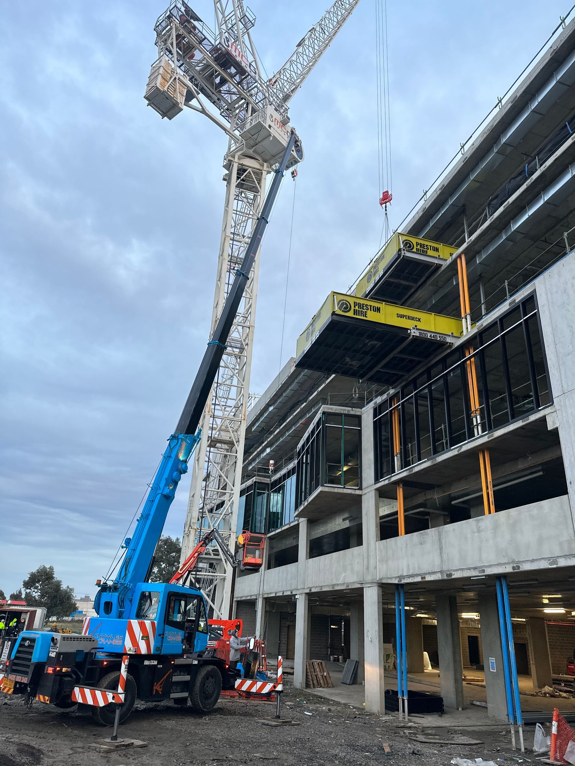 Crane lifting steel beams