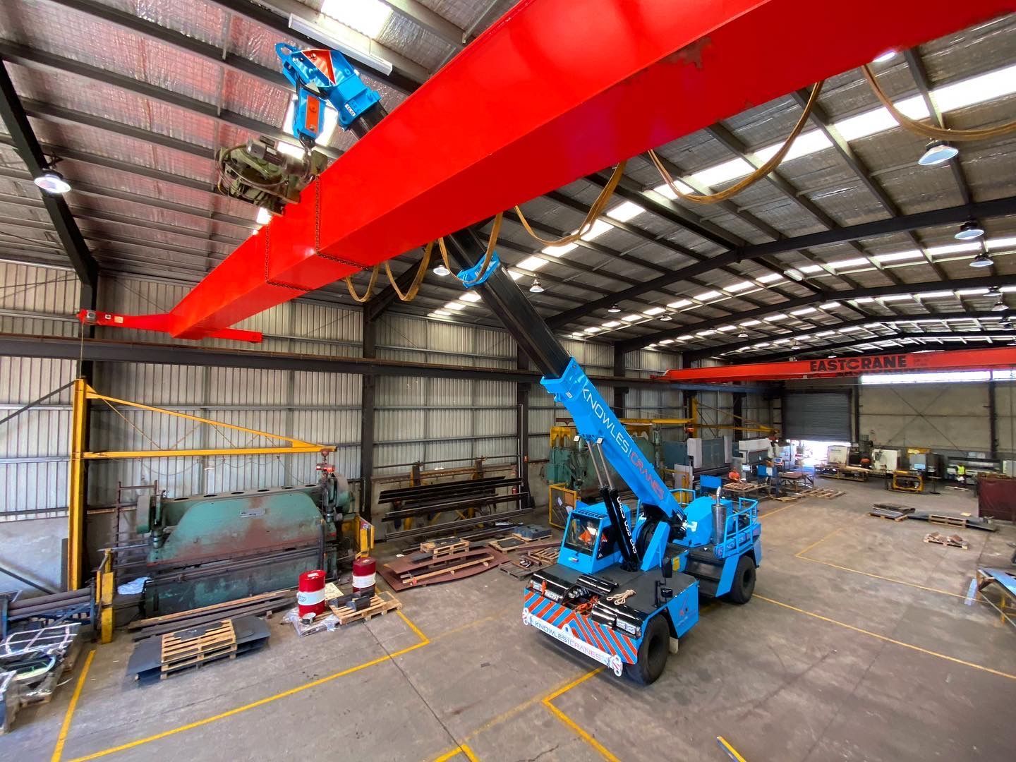 Crane lifting steel beams