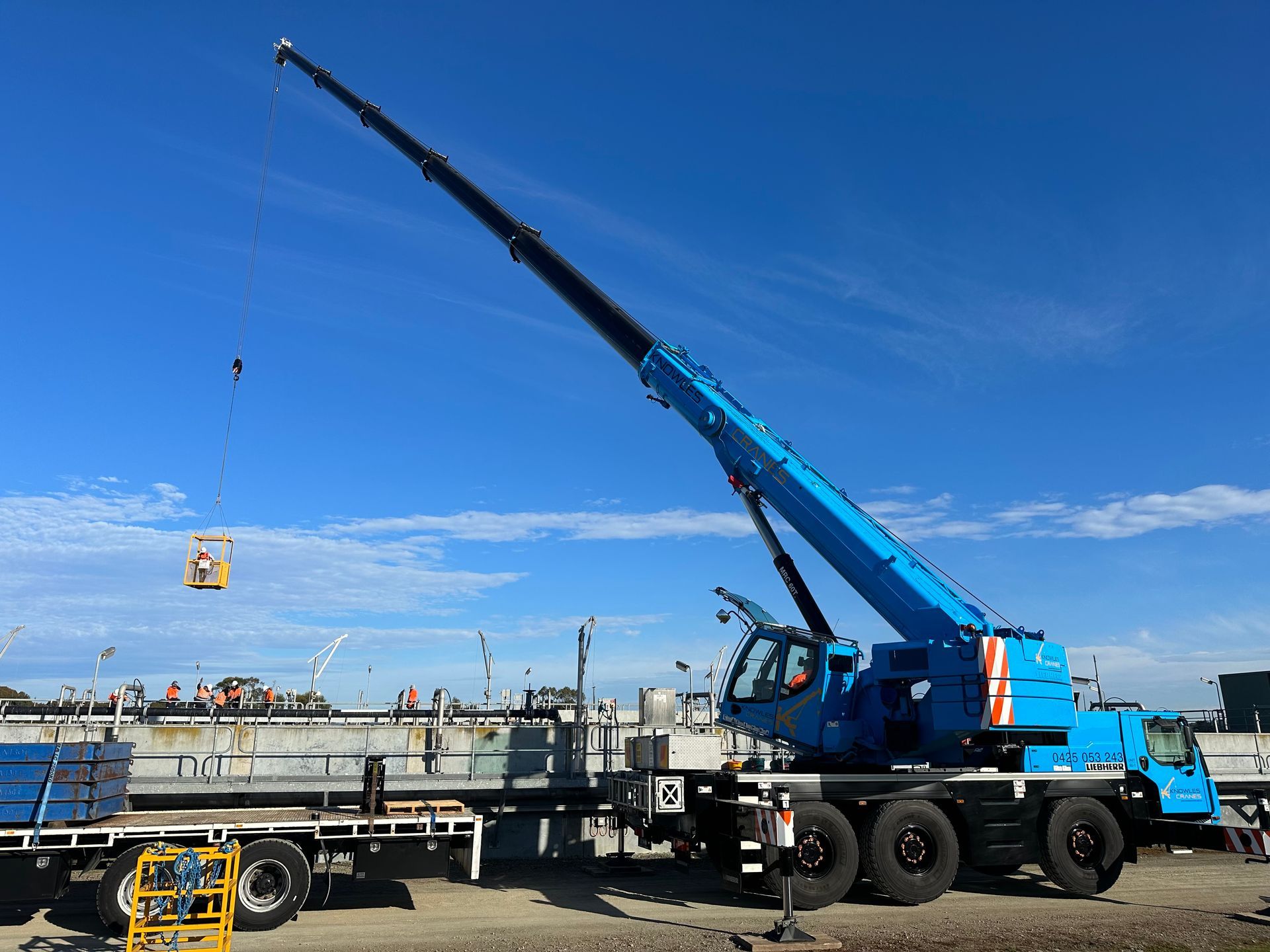 Crane lifting steel beams