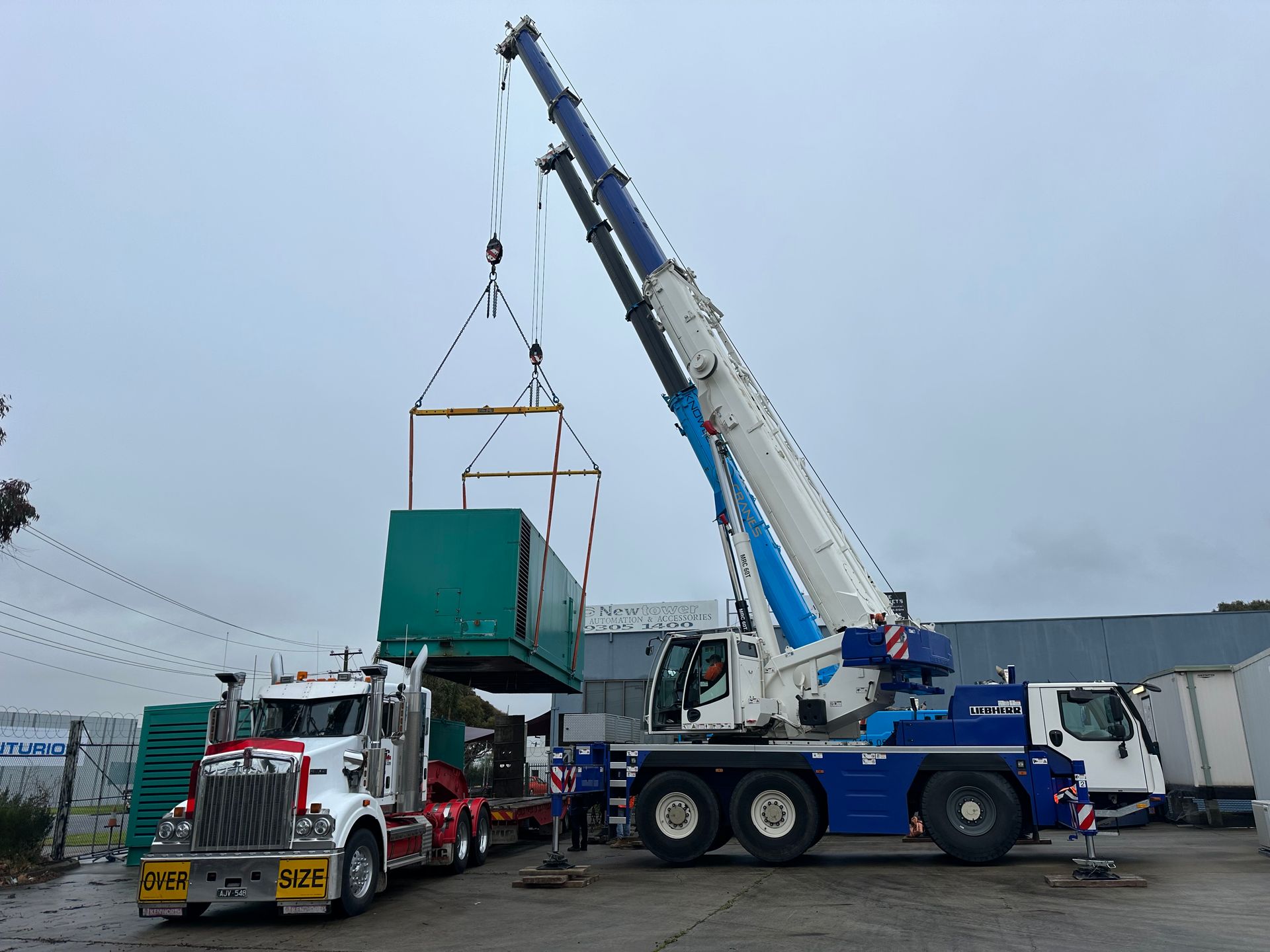 mobile crane lifting a container