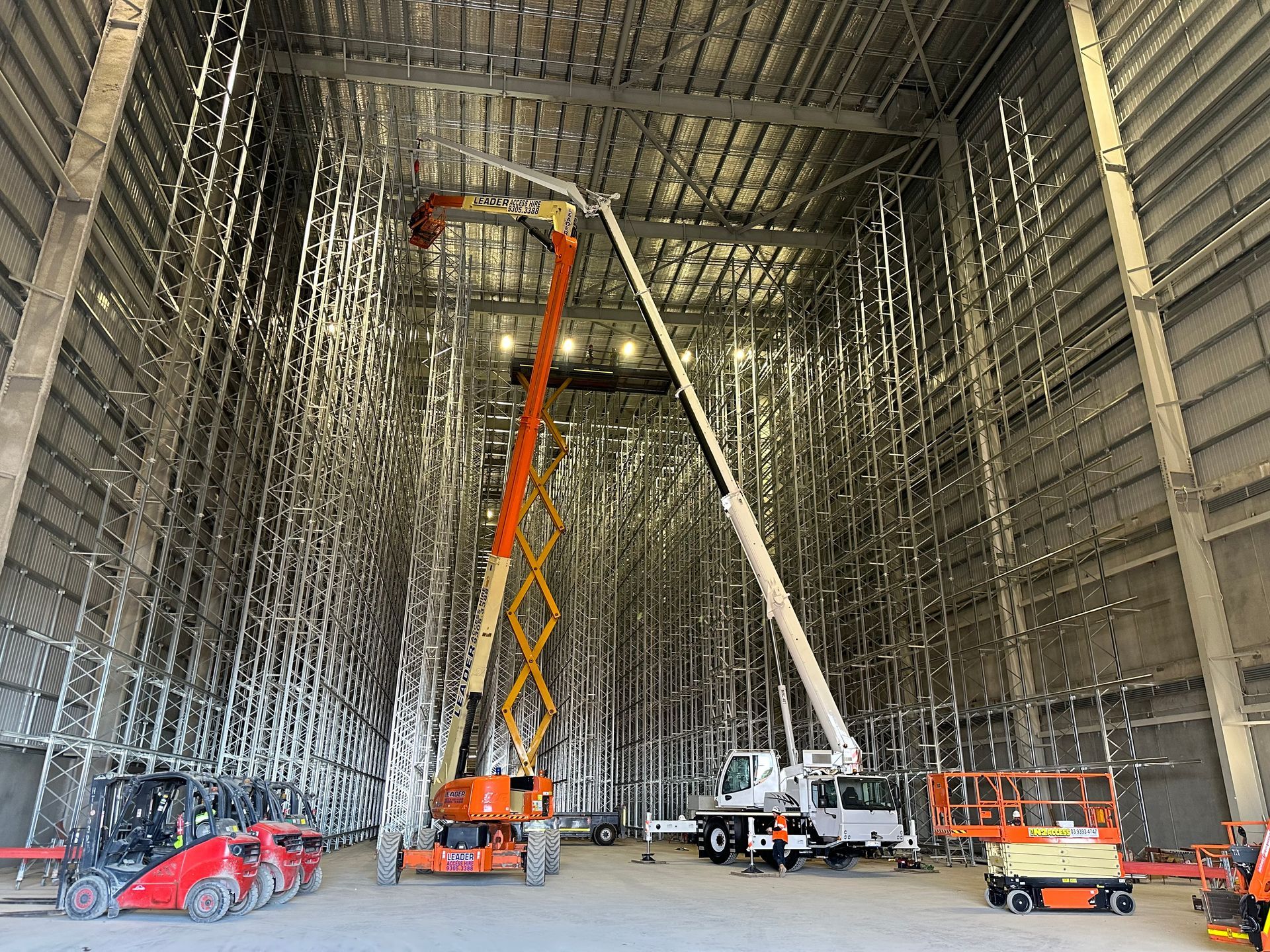 Crane lifting steel beams