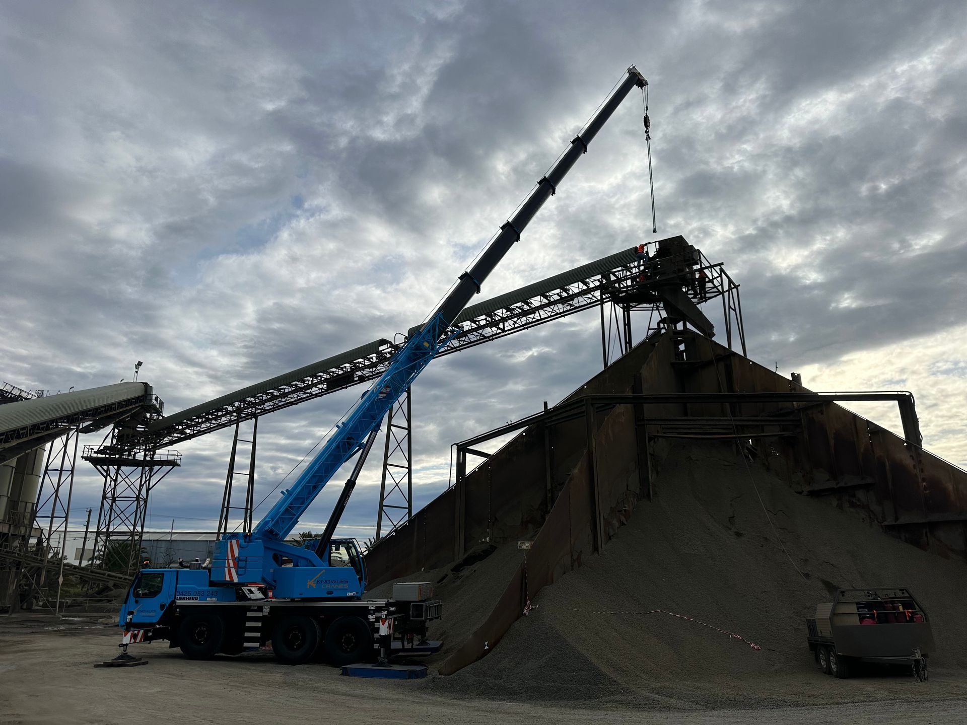 Crane lifting steel beams