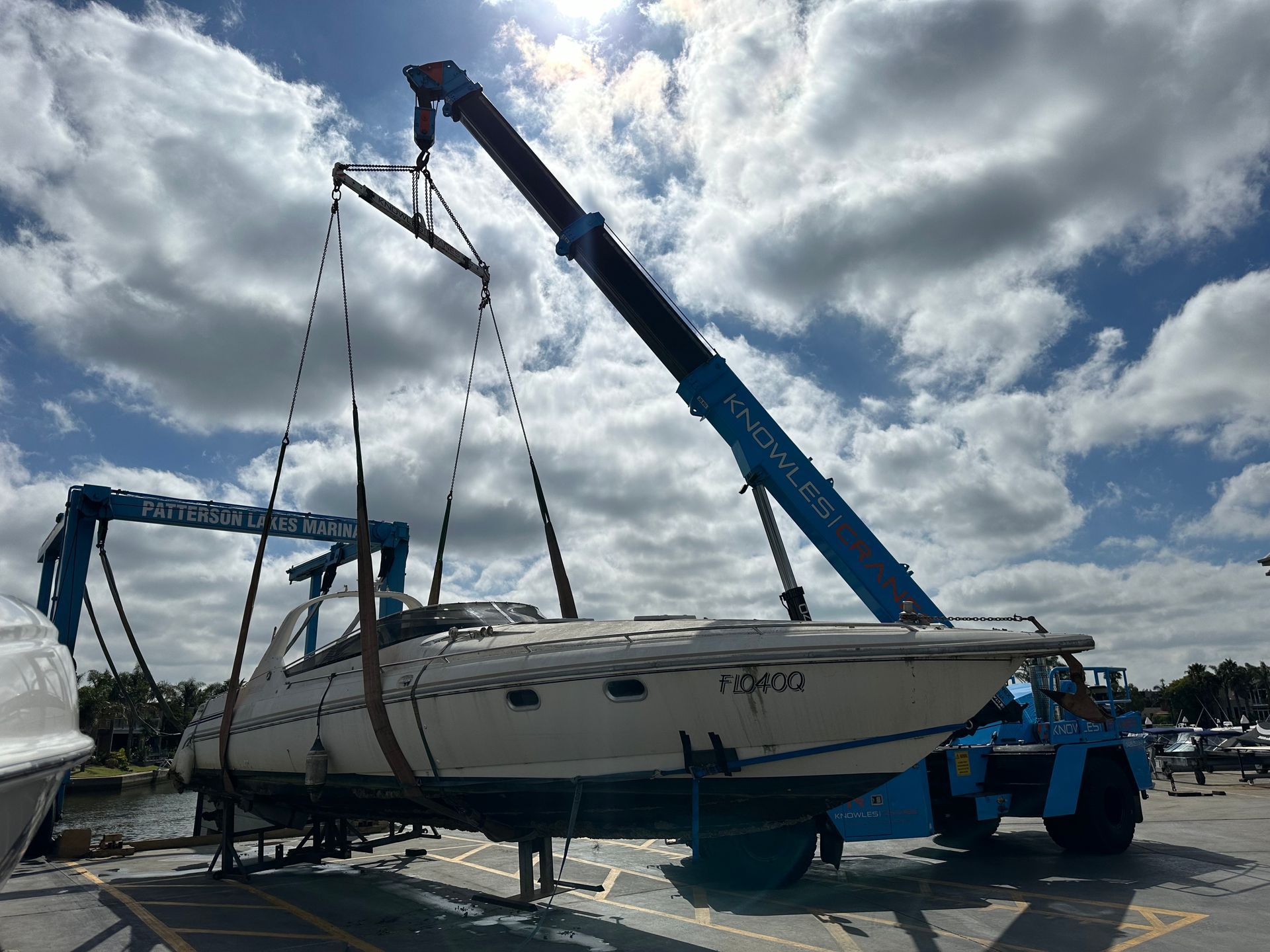 mobile crane lifting a boat