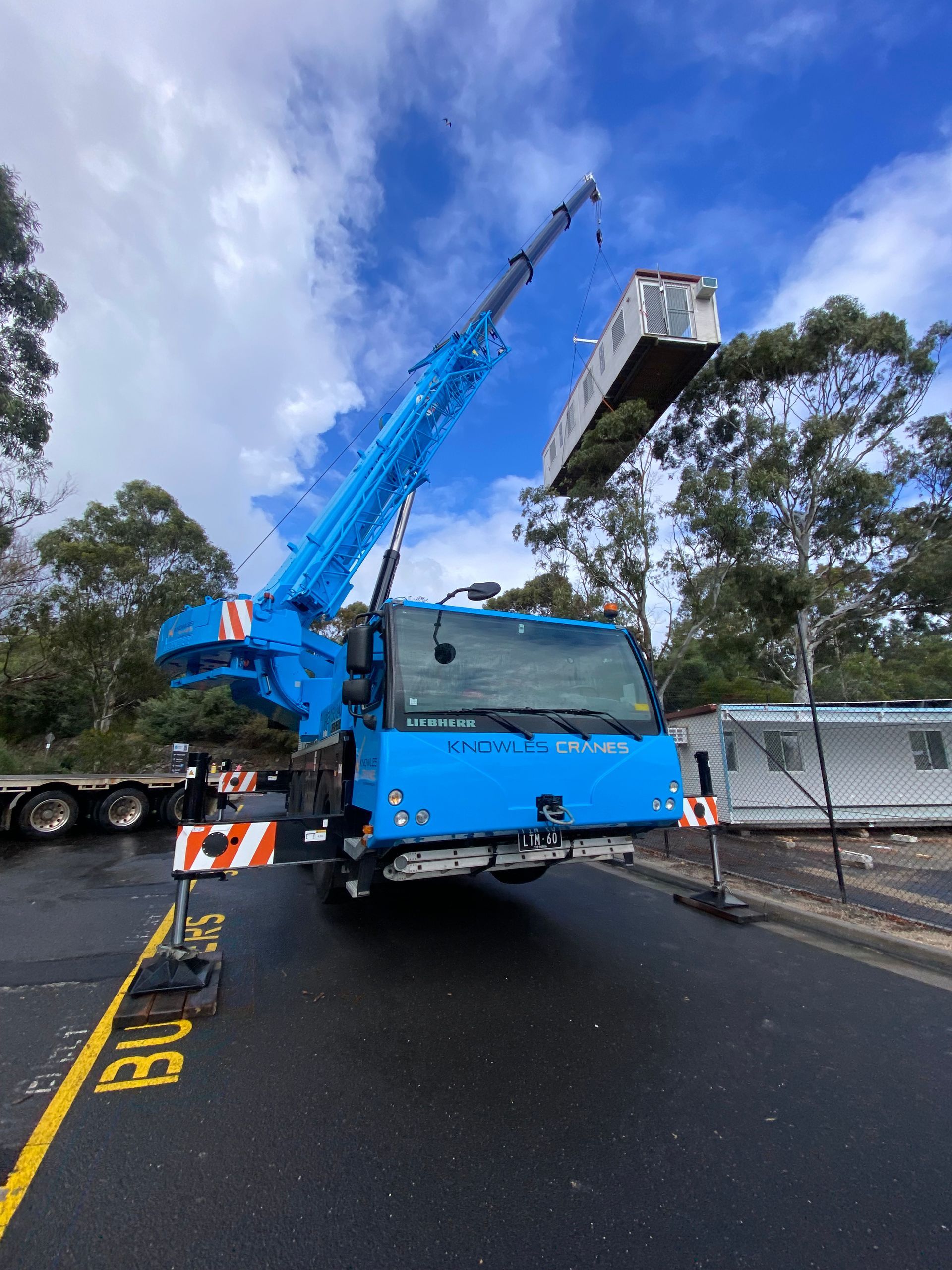 Crane with outriggers extended
