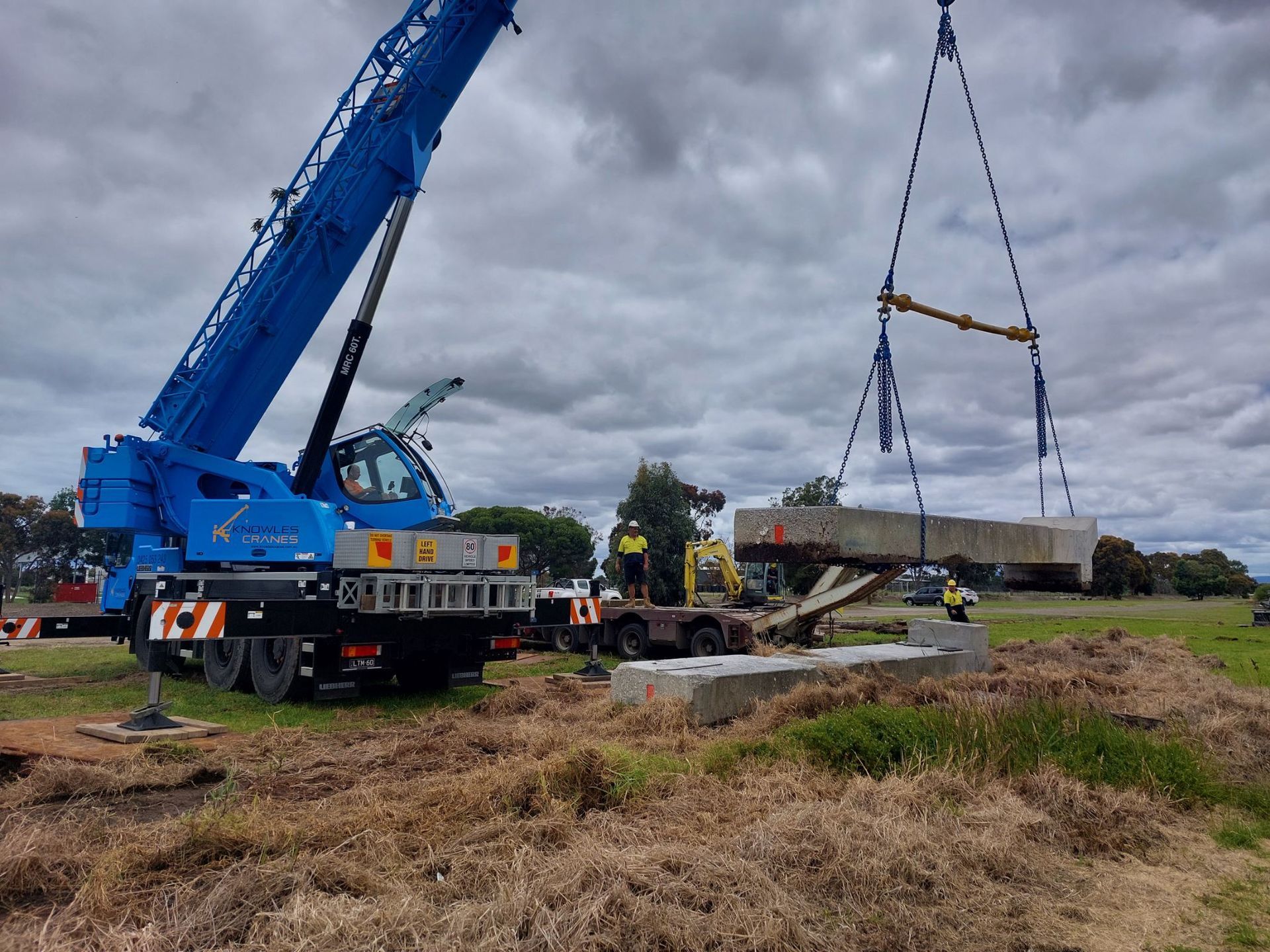 Crane lifting steel beams