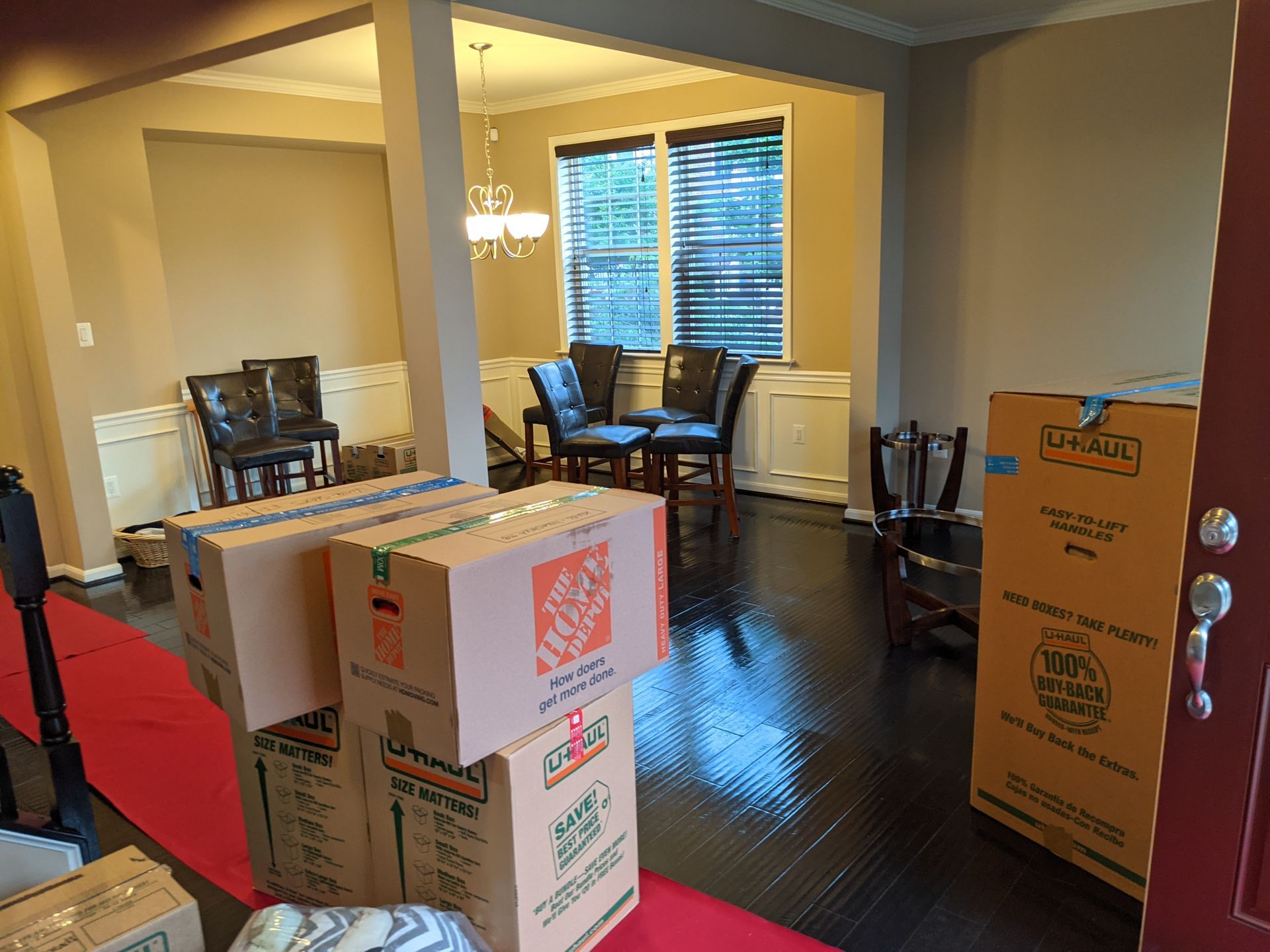 a man and a woman moving in to a new home