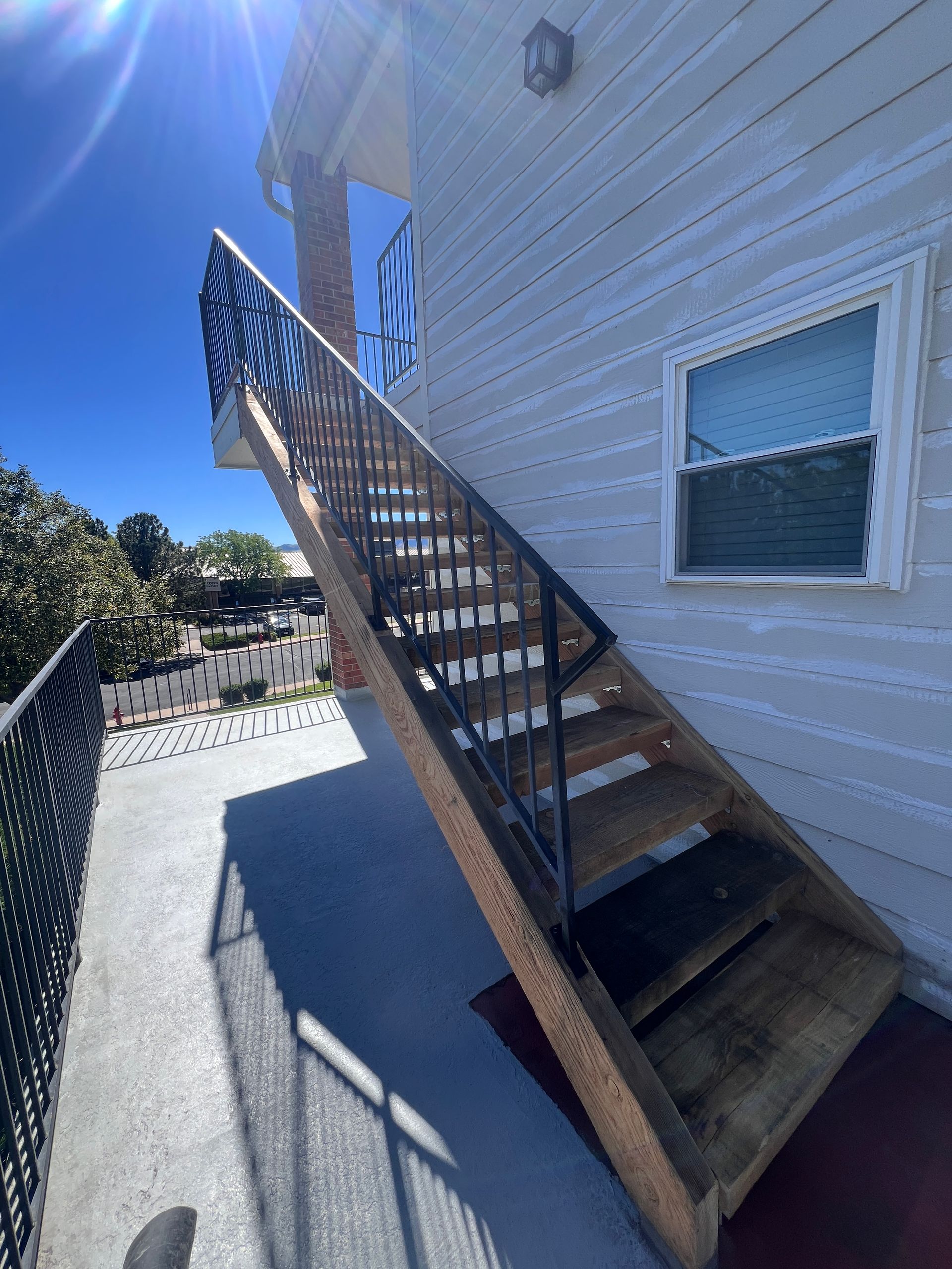 A wooden staircase leading up to the second floor of a house