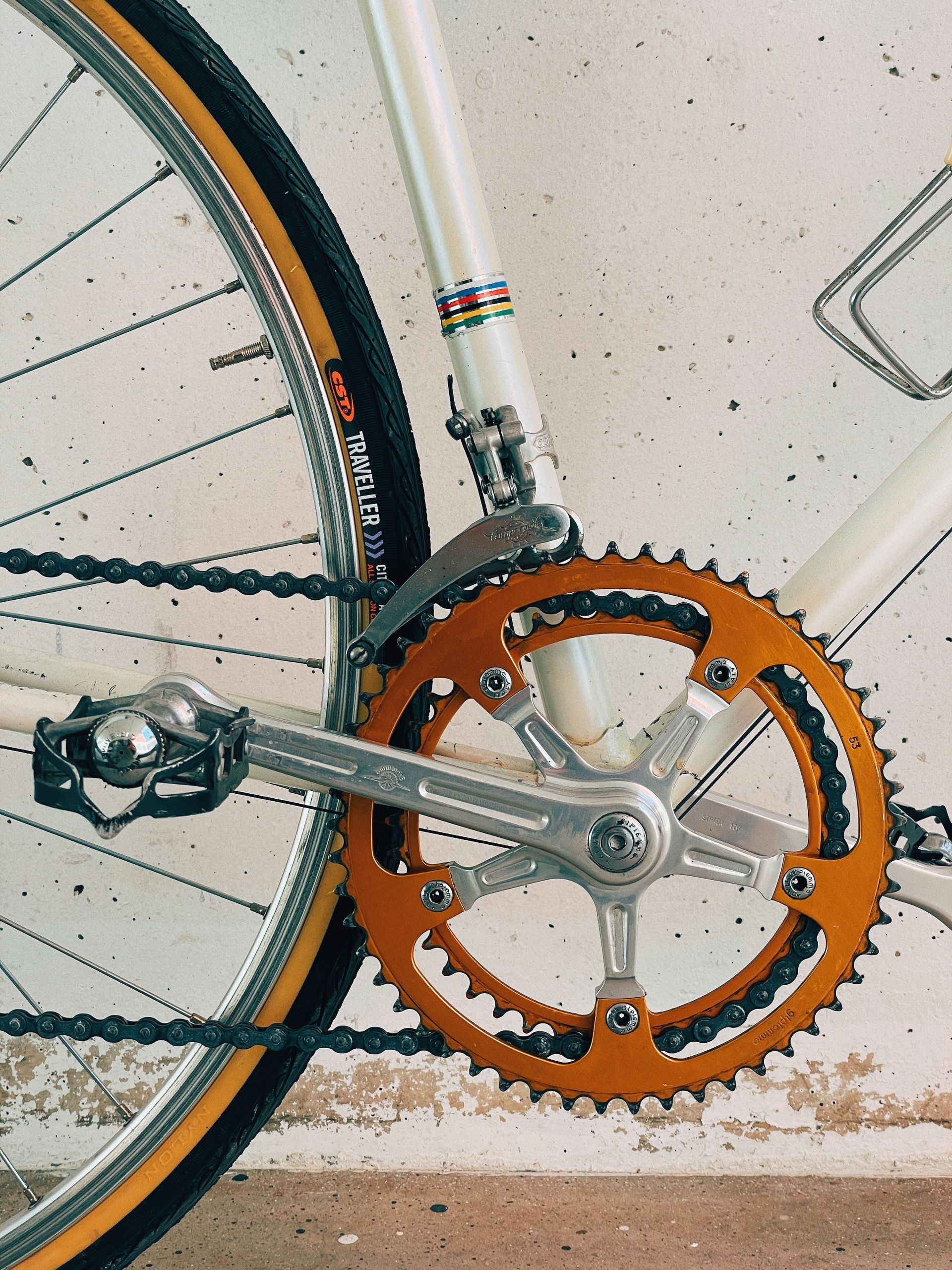 A close up of a bicycle with a chain and pedals