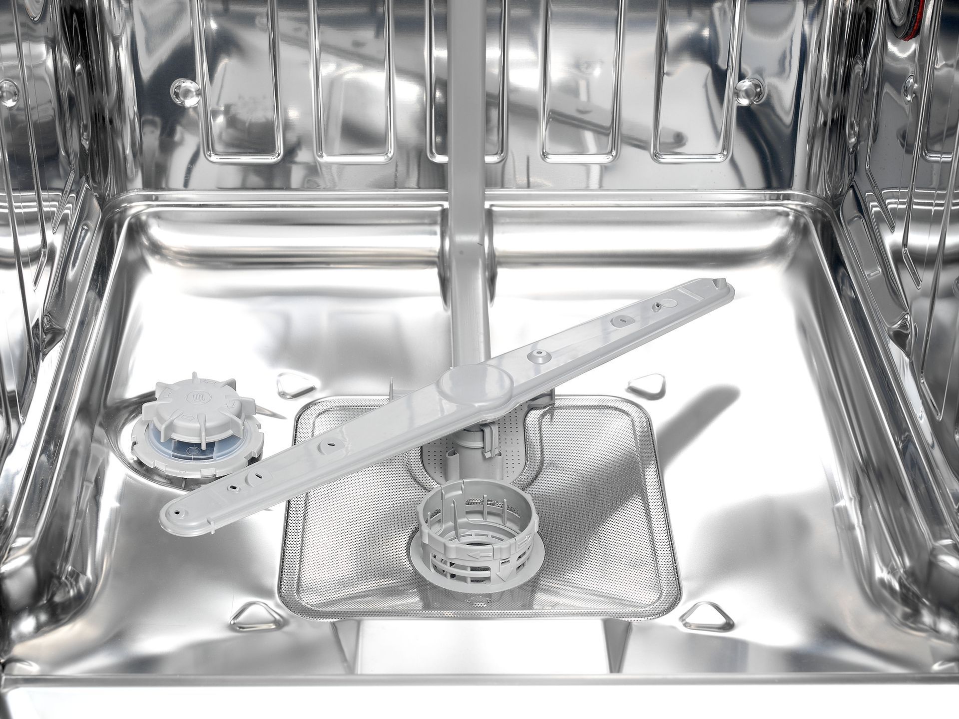 A close up of the inside of a dishwasher with a stainless steel tray.