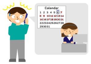 A man is talking on a cell phone next to a calendar.