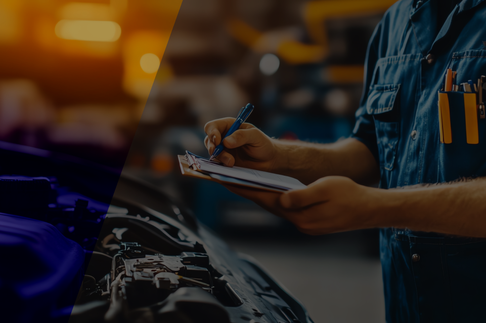 Mechanic in blue jumpsuit, writing on clipboard, inspecting car engine in a garage.
