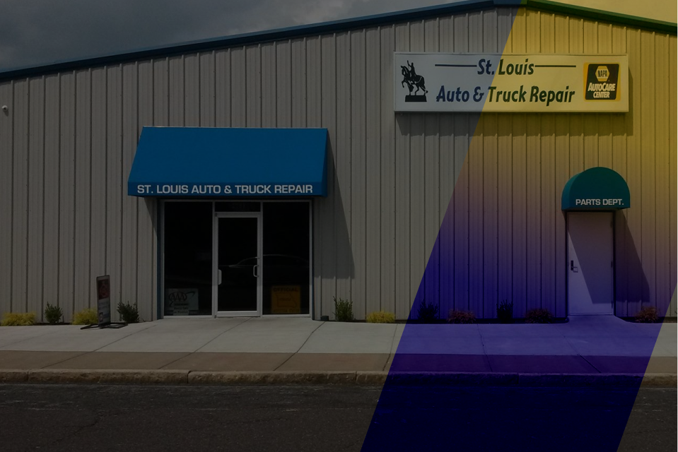St. Louis Auto & Truck Repair building with blue awnings and sign. | St. Louis Auto & Truck Repair