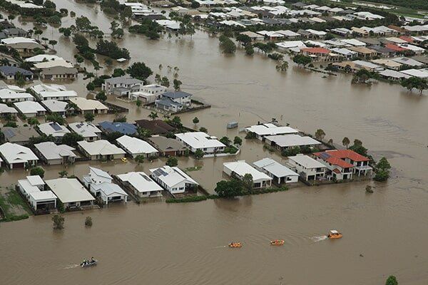Flood Waters Around Homes — Builder In Whitsundays, QLD