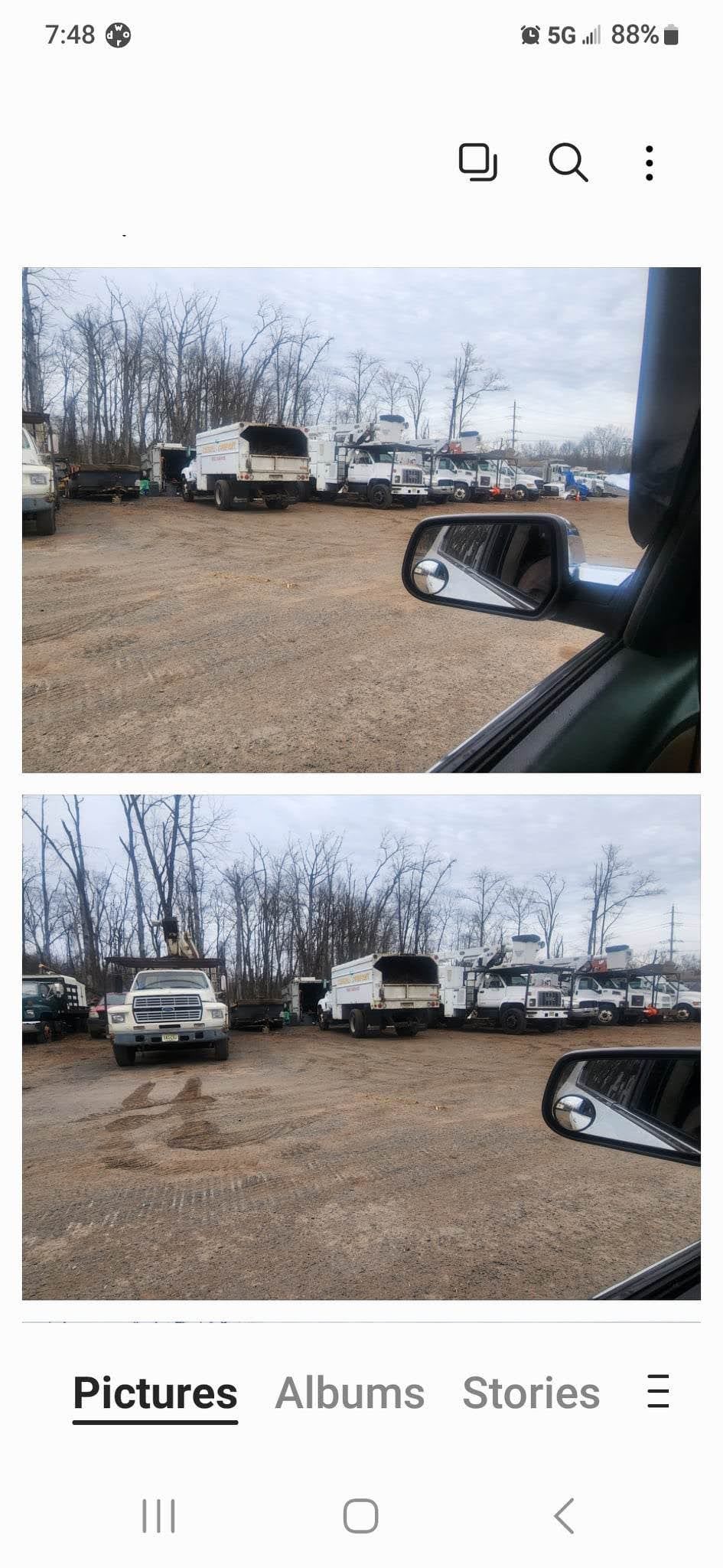 A Person Is Looking at Their Rear View Mirror in A Parking Lot – Lawrence Township, NJ – Carroll Tree Service