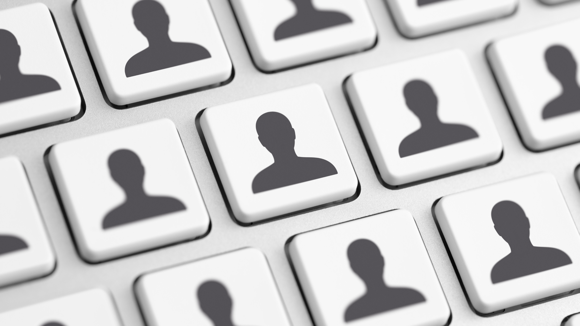 White keyboard with person icon buttons, representing user profiles.