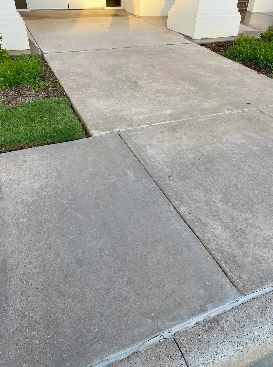 Power washing concrete entrance and exterior of Prosperity Bank