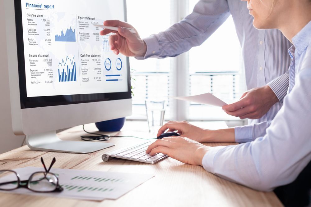 Two People Reviewing a Financial Report — Precision Financial & Tax In Ross Creek, VIC