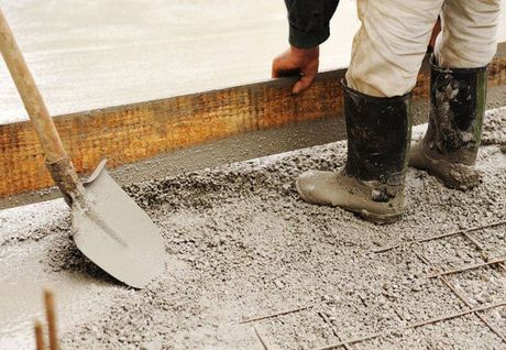 workman leveling concrete