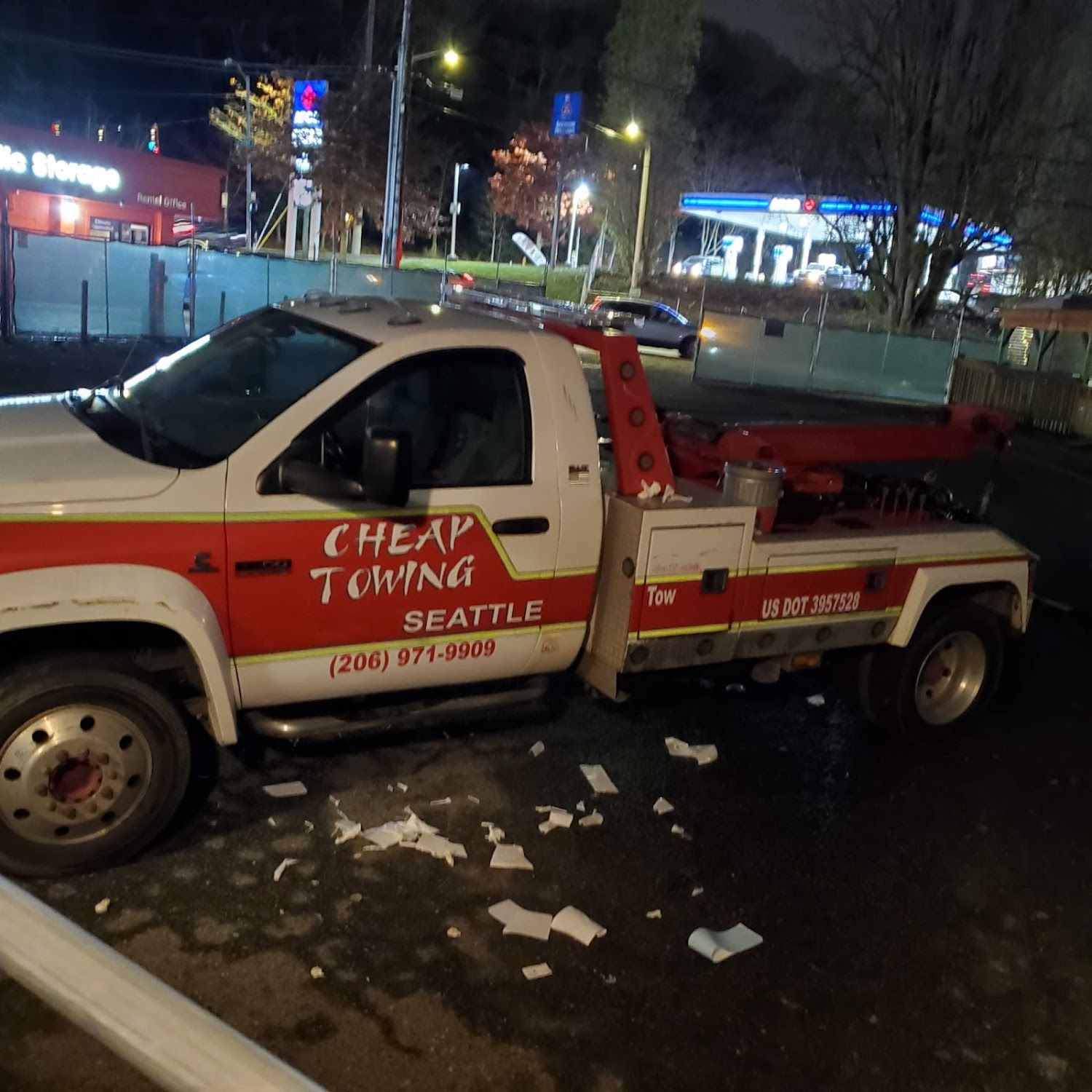 A red and white tow truck from cheap towing seattle