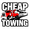 A red tow truck is towing a white car on a road.