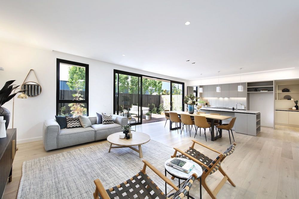 A Living Room with Couch and Kitchen — KM Custom Homes In Mount Eliza, VIC