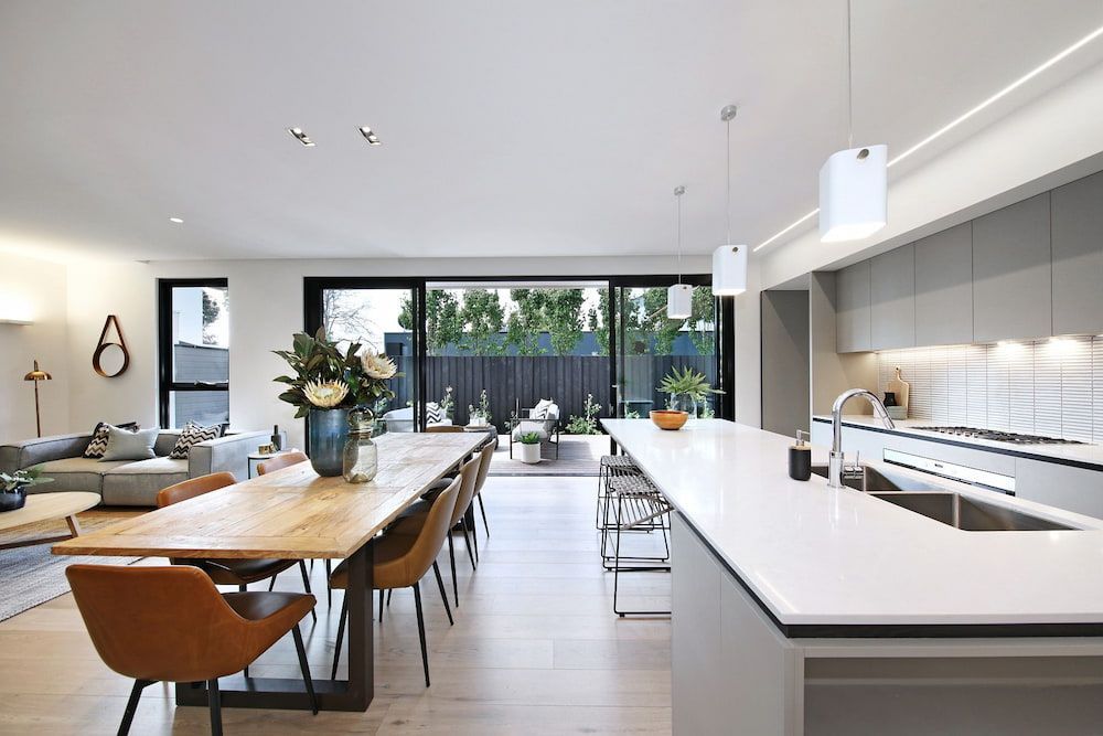 A modern Kitchen Dining Area Leading To Outside — KM Custom Homes In Mount Eliza, VIC