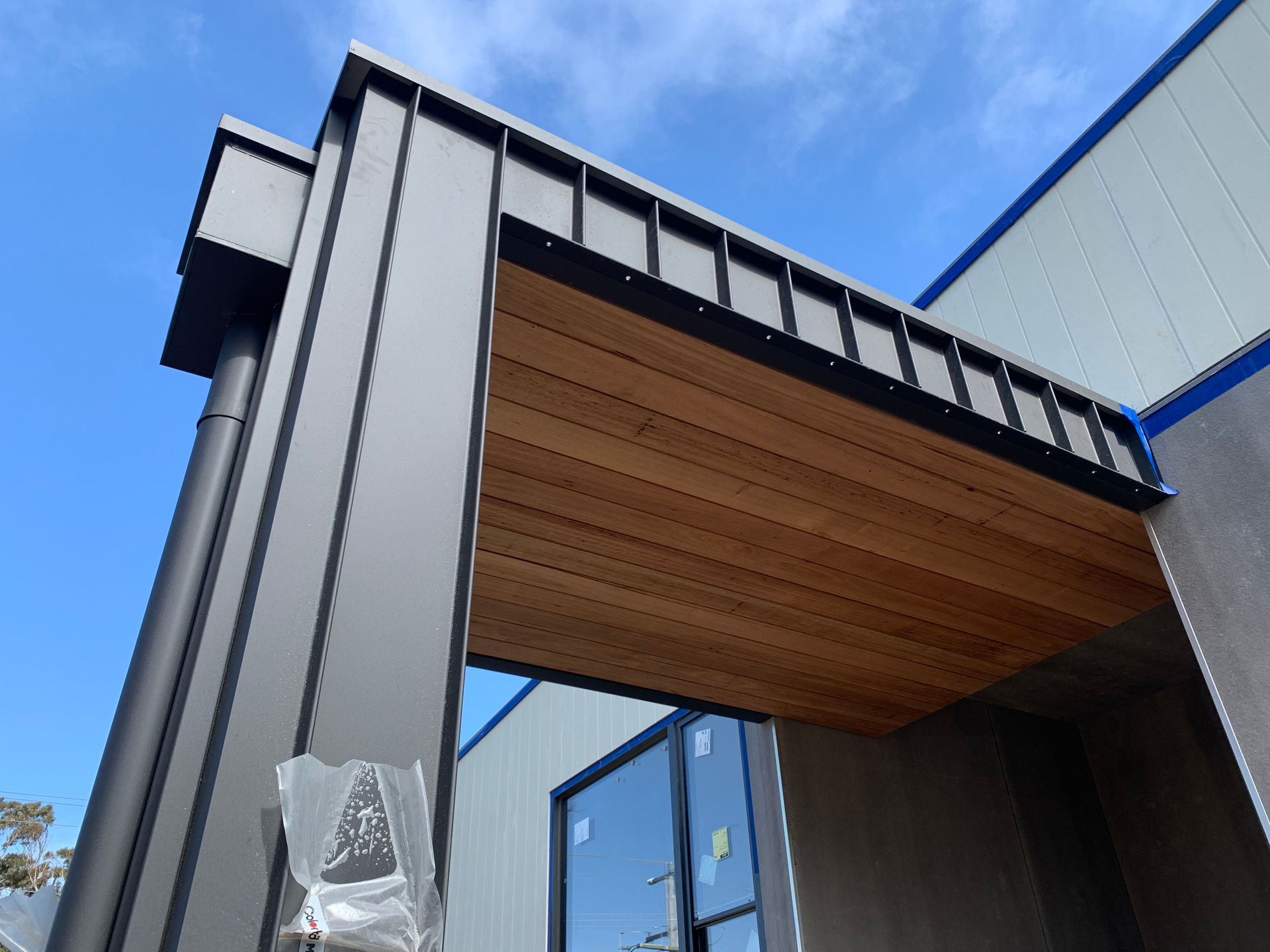 A Building With A Wooden Ceiling And A Metal Roof — KM Custom Homes In Mount Eliza, VIC