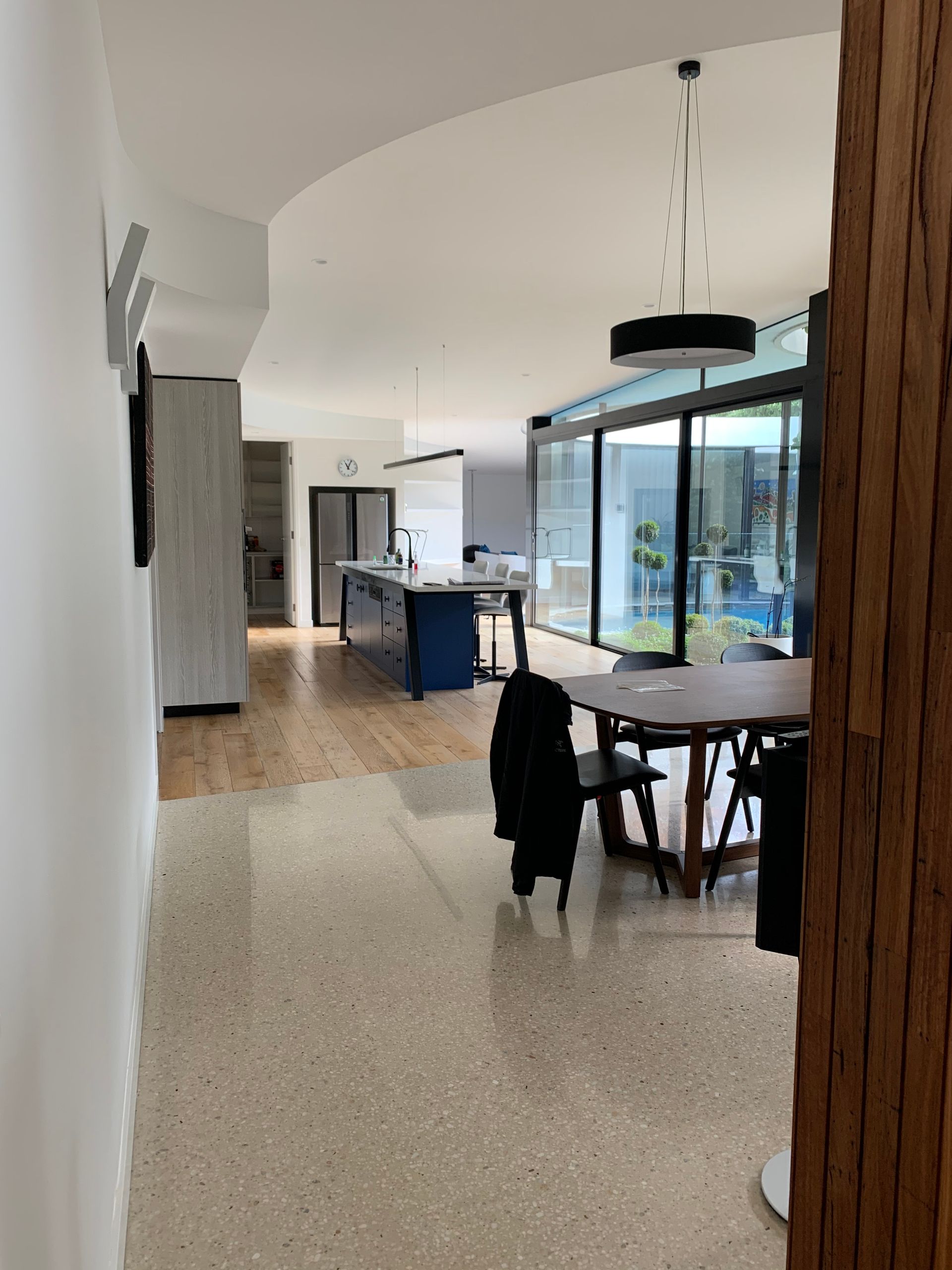 There Is A Table And Chairs In The Middle Of The Room — KM Custom Homes In Mount Eliza, VIC