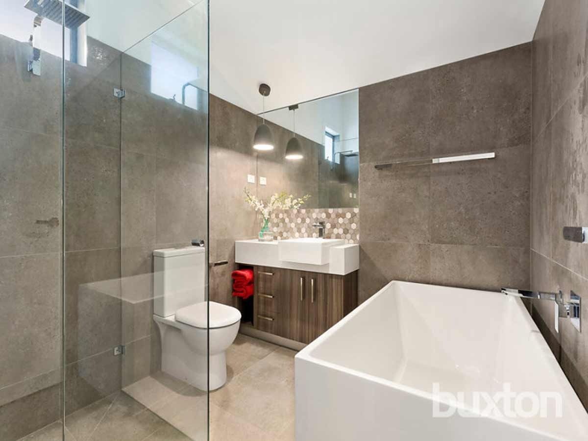 A Bathroom With a Toilet a Sink and a Bathtub — KM Custom Homes In Mount Eliza, VIC