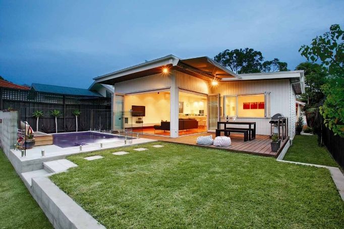 The Backyard of a House With a Swimming Pool and a Patio — KM Custom Homes In Mount Eliza, VIC