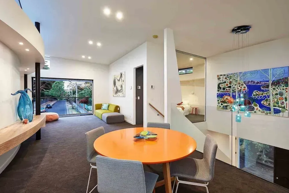 Modern Living Room With Round Orange Table — KM Custom Homes In Mount Eliza, VIC