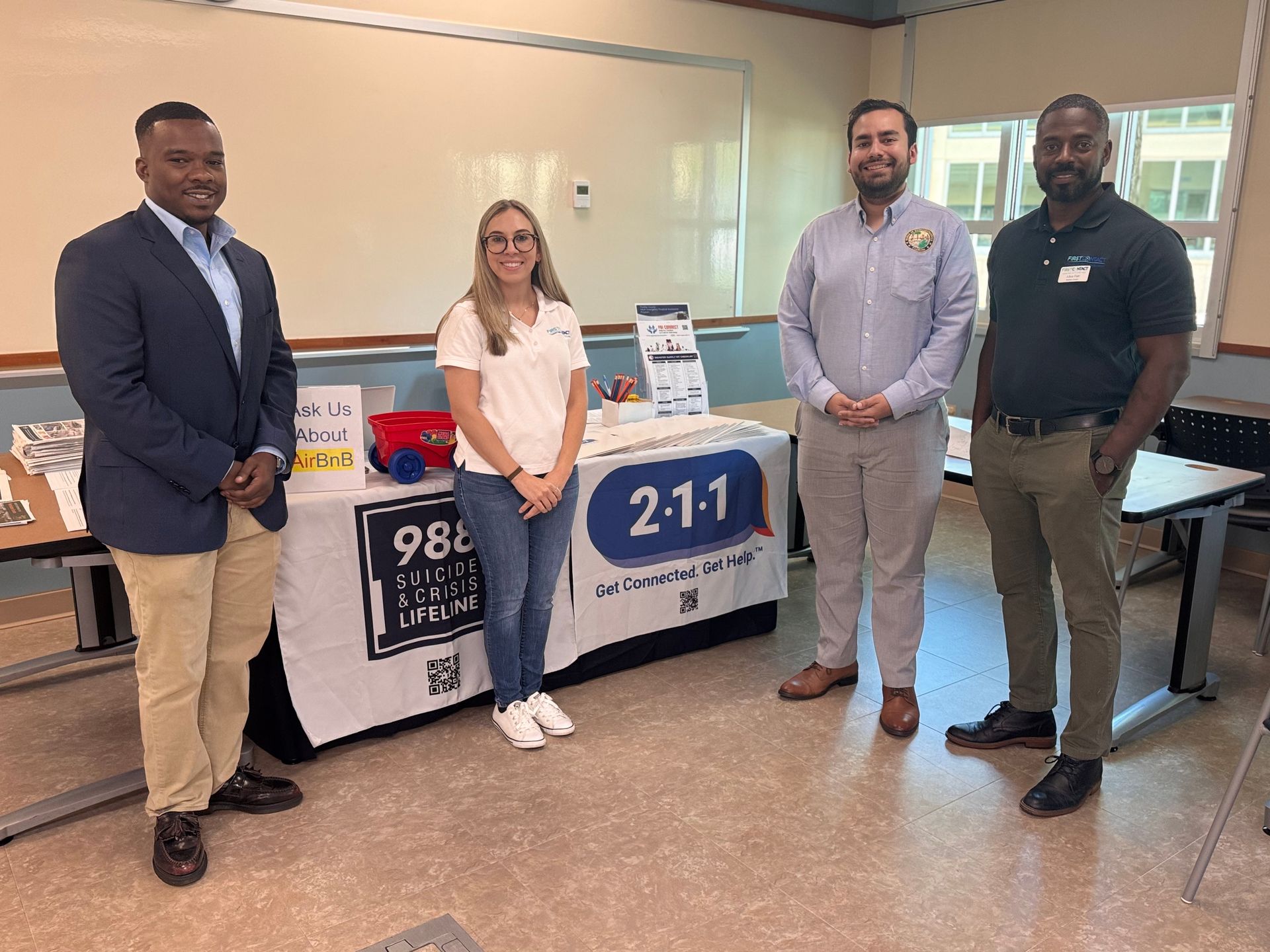 Pictured: Kameron Mitchell, Public Affairs Specialist, Small Business Administration (Atlanta, GA); Reanna Schutz, Ambassador, First Contact; Benjamin Roy, District Aide, State Representative Berny Jacques; Alton Farr, Database Curator, First Contact.