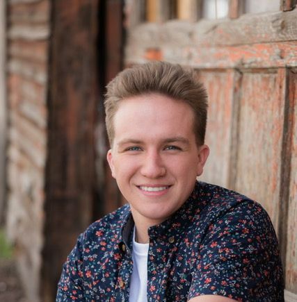 Smiling Woman Holding an Invisalign — Caldwell, ID — Webster Orthodontics