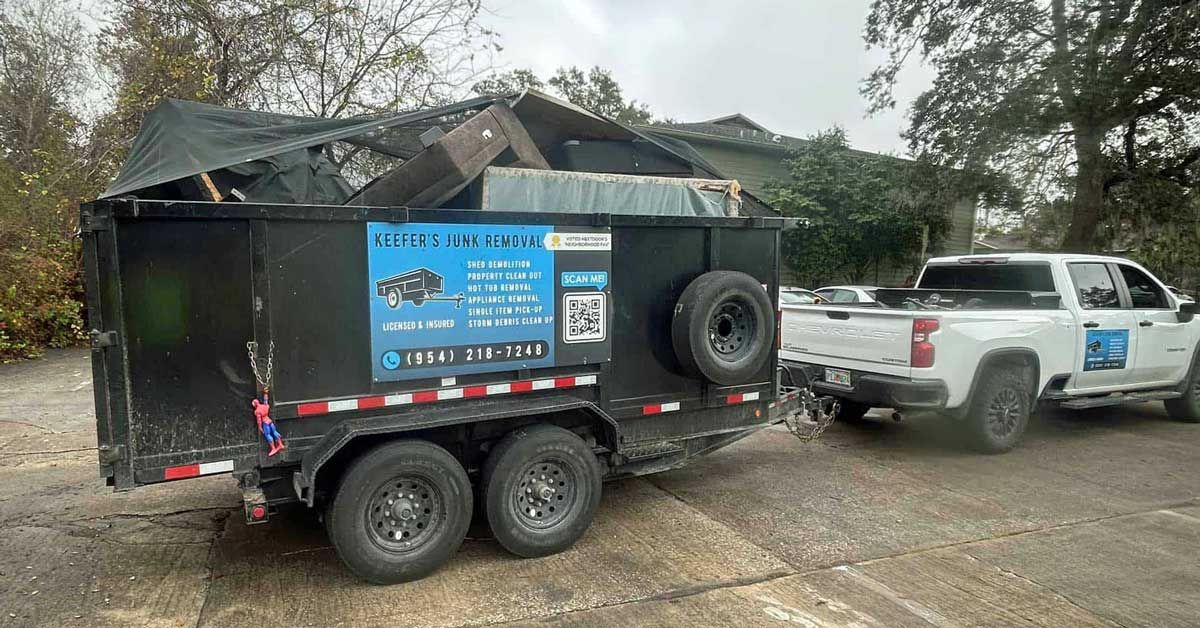 Keefer's Junk Removal's dumpster trailer is loaded with debris.