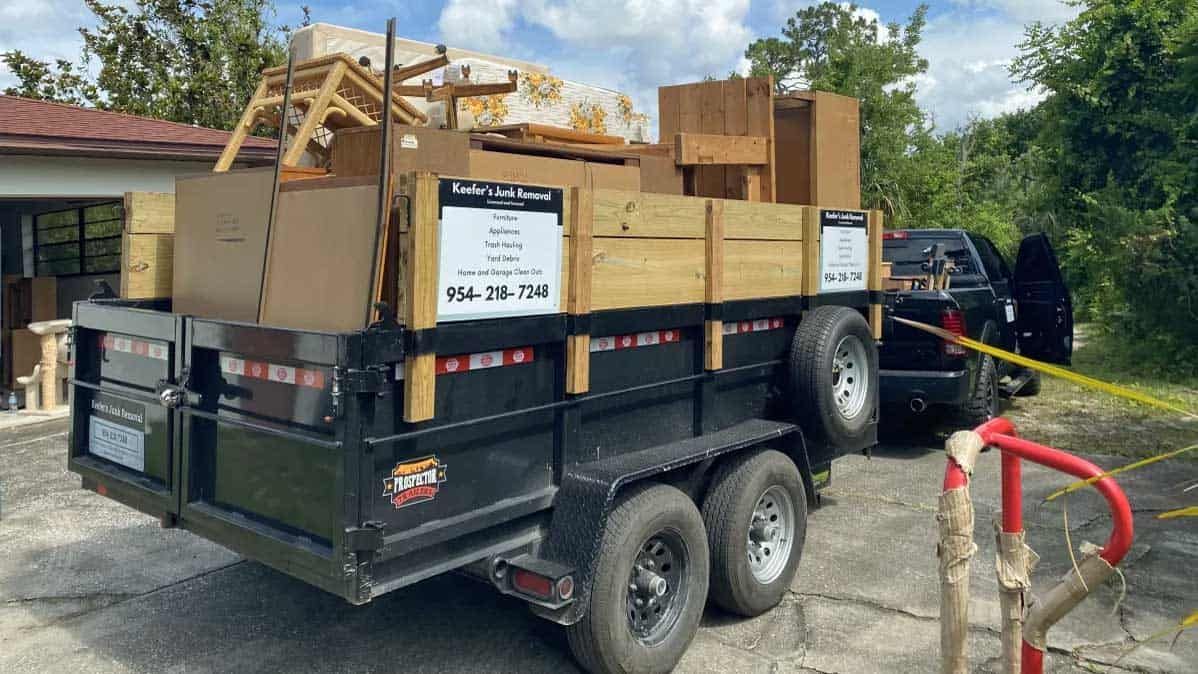 Keefer's Junk Removal's trailer is loaded with furniture and boxes