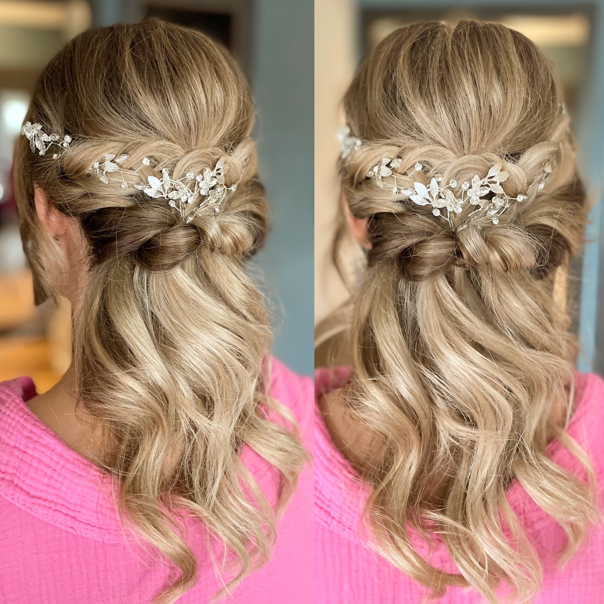 Eine Frau in einem rosa Hemd trägt eine halb hochgesteckte, halb offene Frisur und Blumen im Haar.