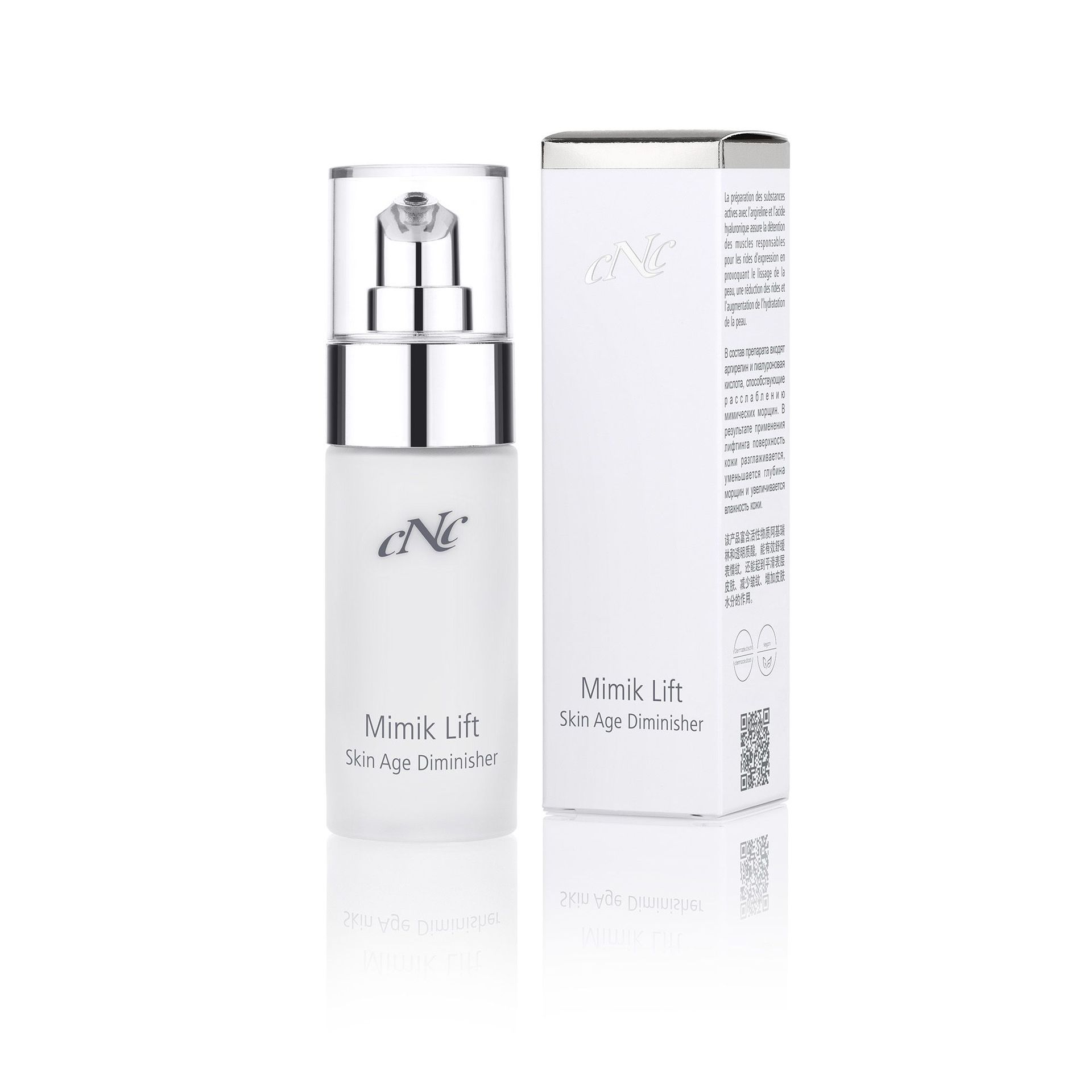 Eine Flasche Lotion neben einer Schachtel auf weißem Hintergrund.