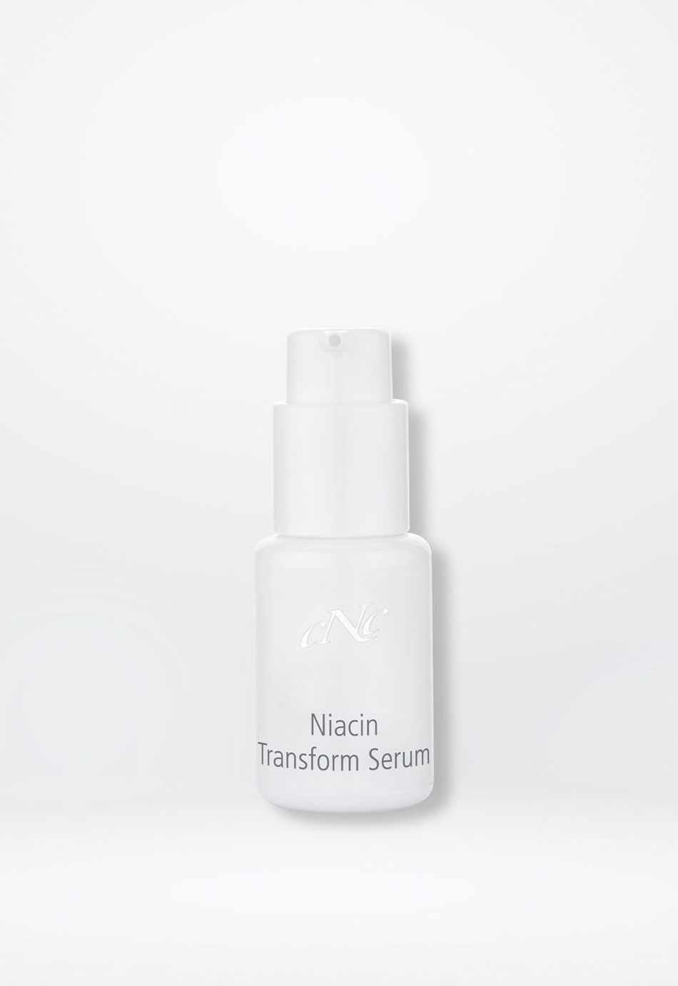 Eine weiße Flasche Lotion steht auf einer weißen Fläche.