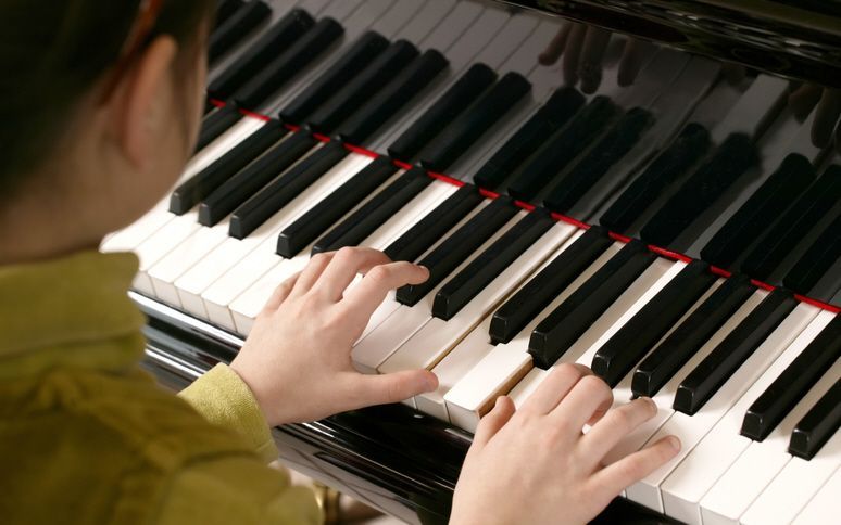 Young person playing the piano