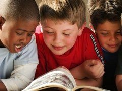 boys reading a book