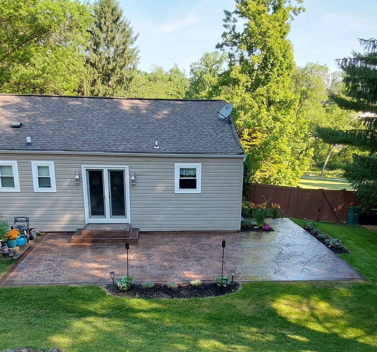 A small house with a patio in front of it
