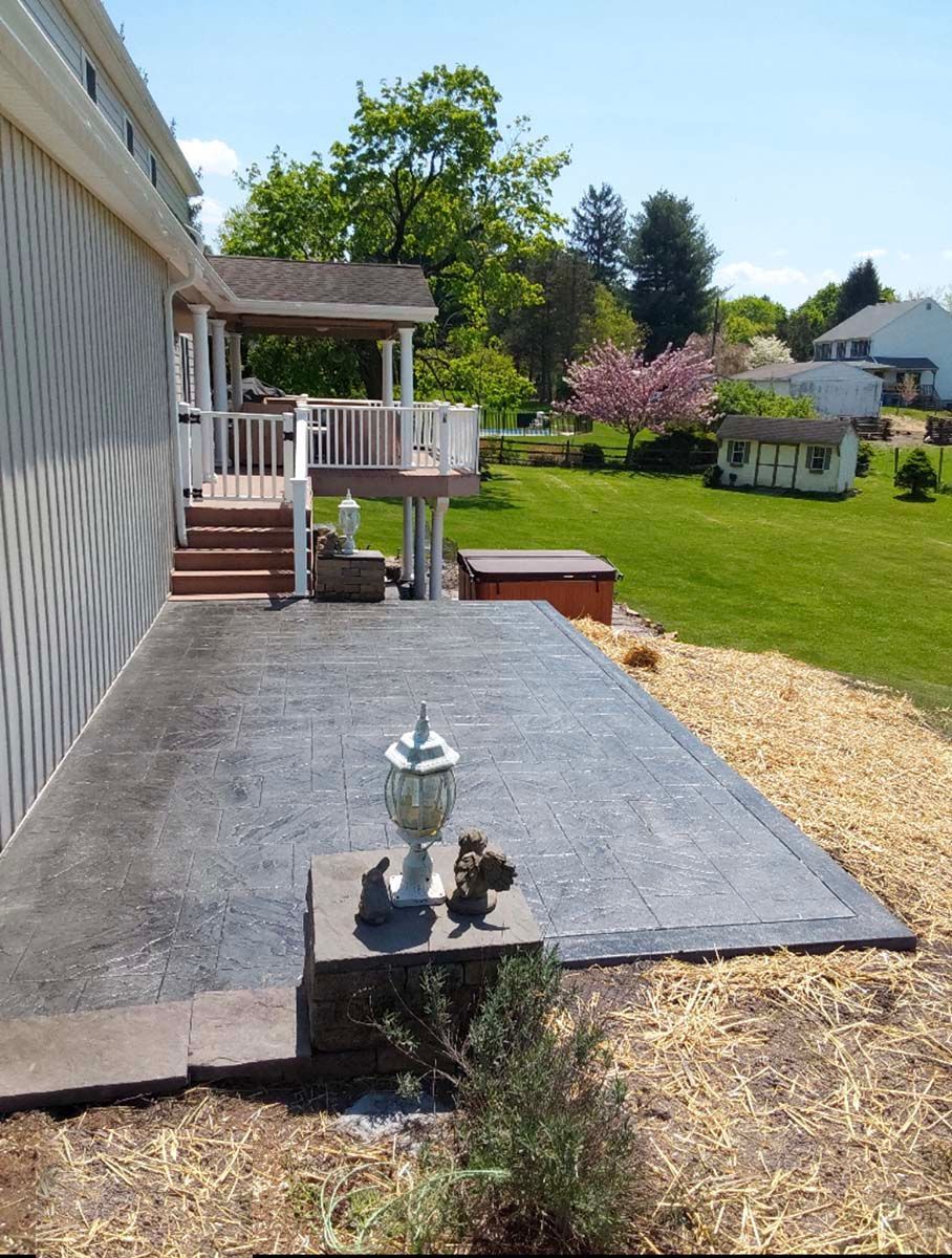 The backyard of a house with a patio and a deck