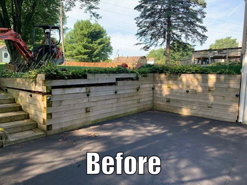 A picture of a wooden retaining wall before being built.